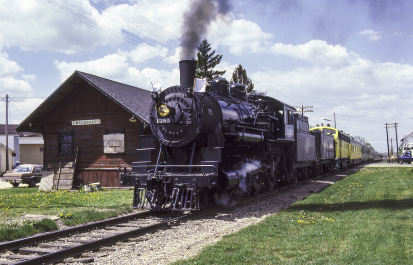 Photo of CNW 1385 Passing the Depot at Waunakee, WI